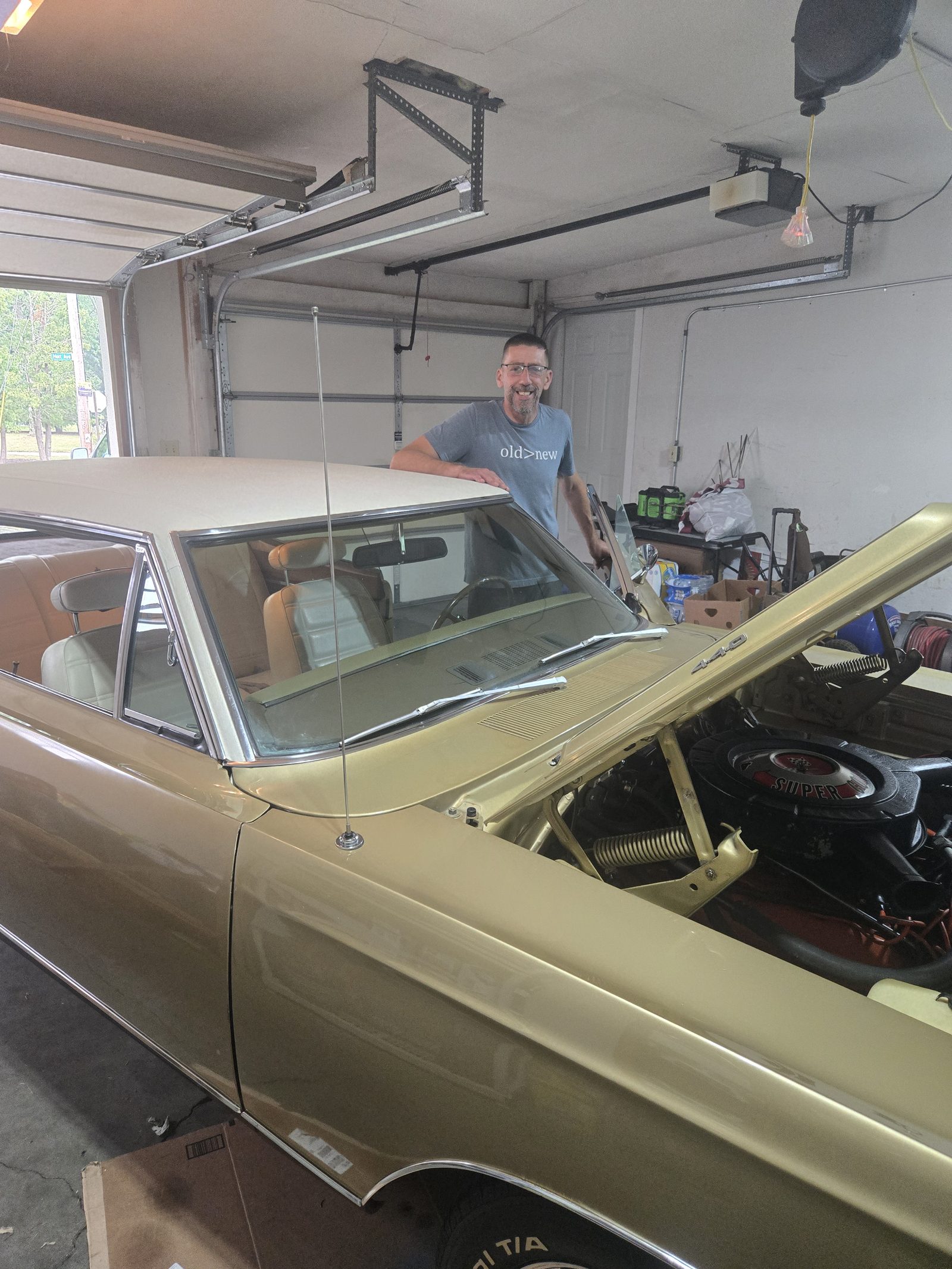 David working on a classic American car
