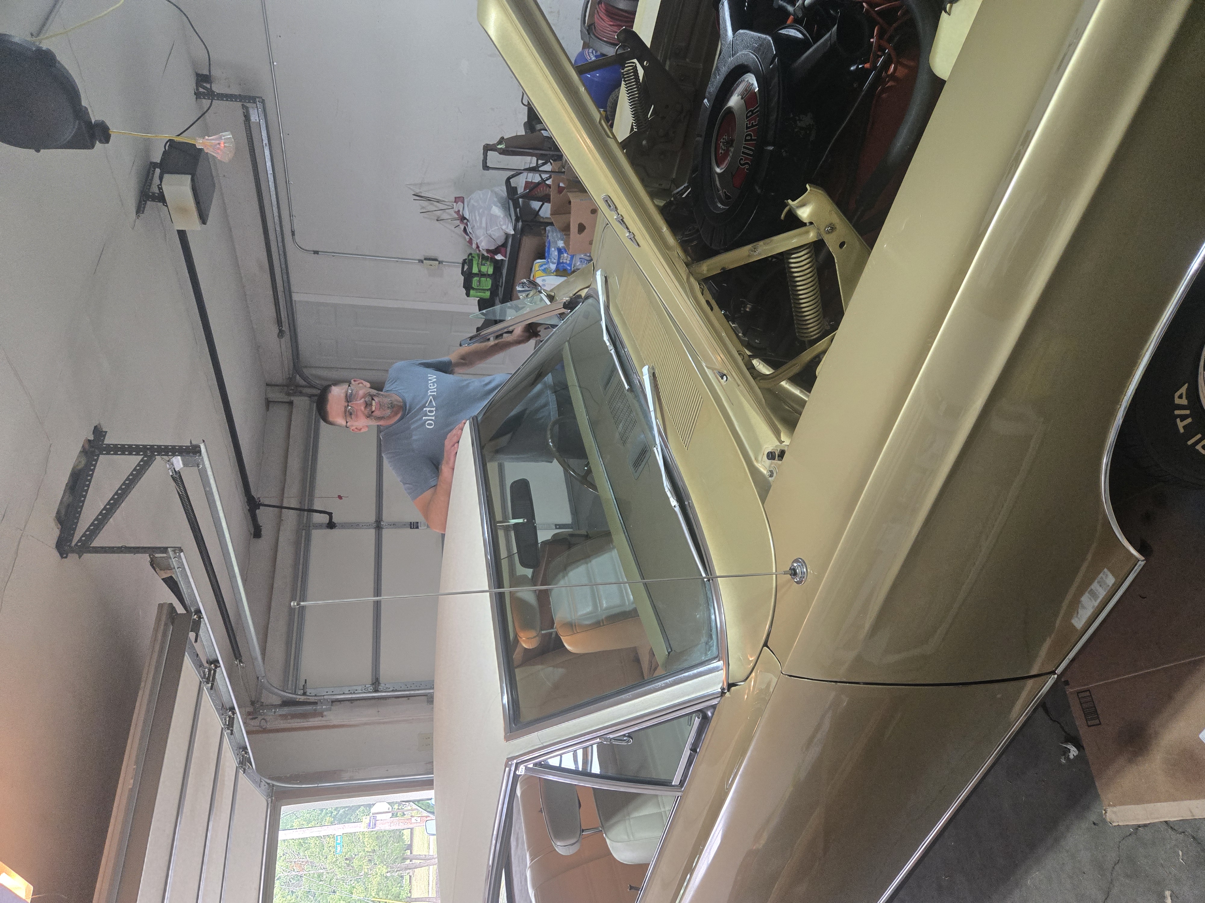 David working on a classic American car