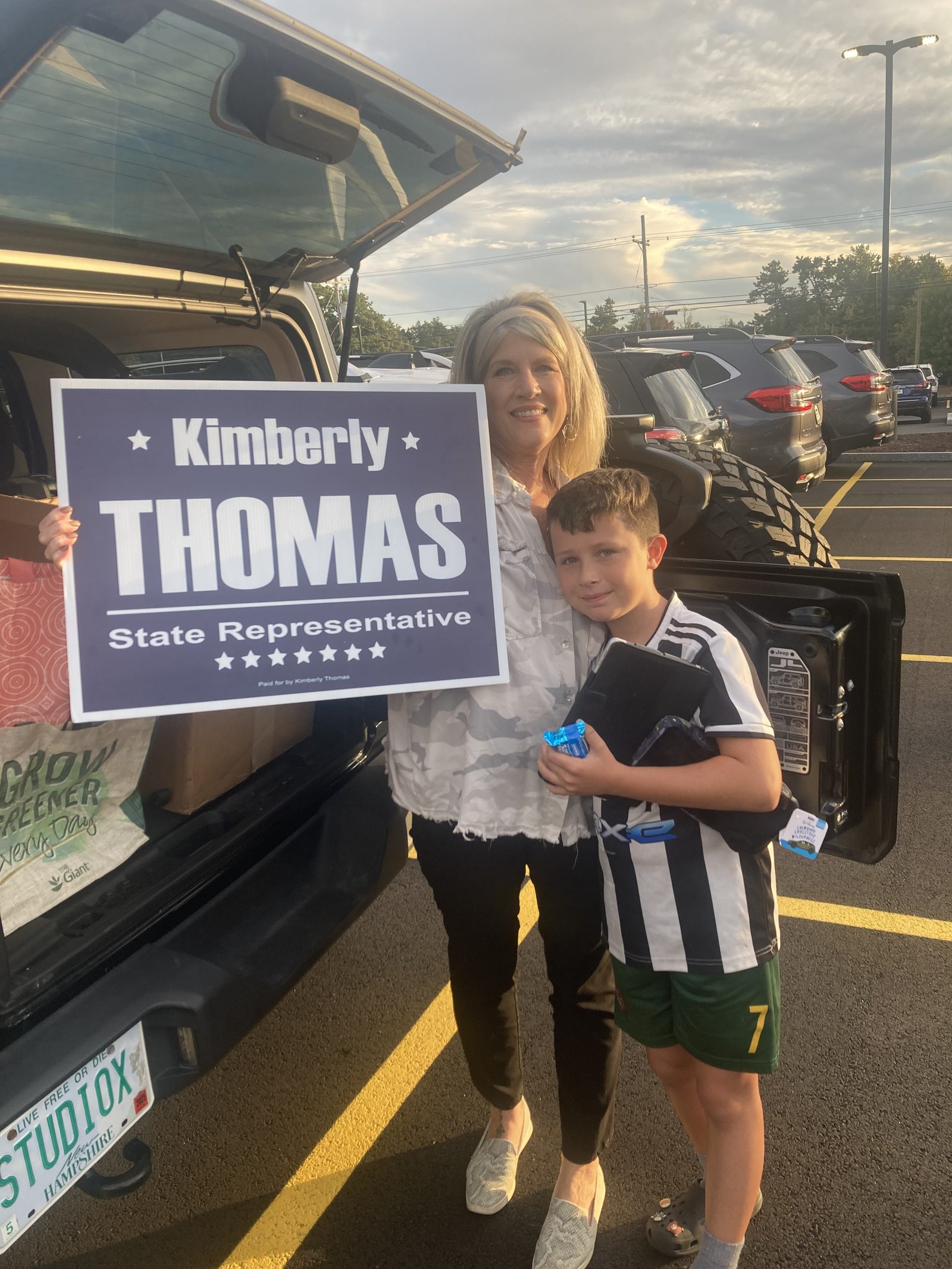 Kimberly Thomas on the campaign trail with a young supporter