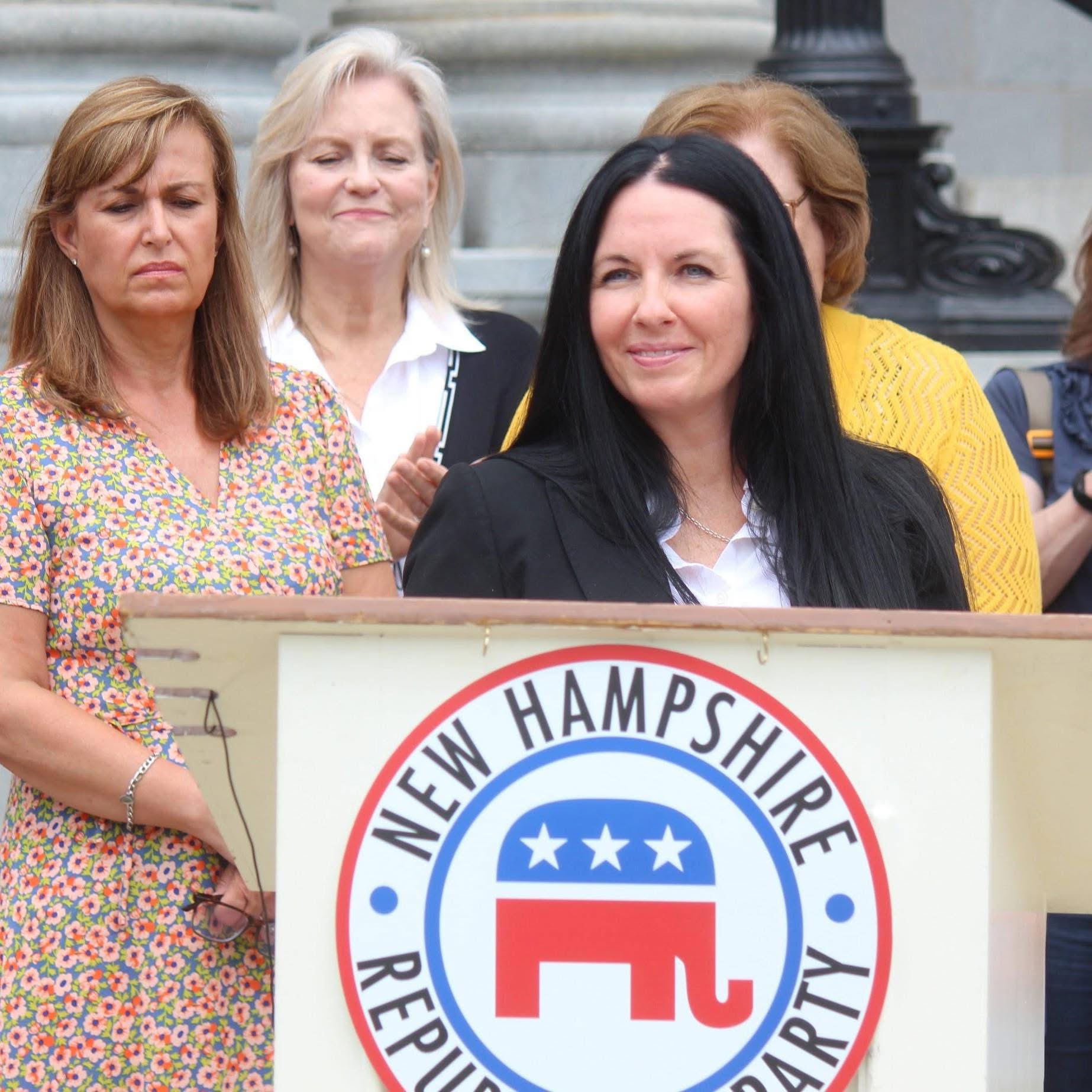 Sayra DeVito speaking at podium