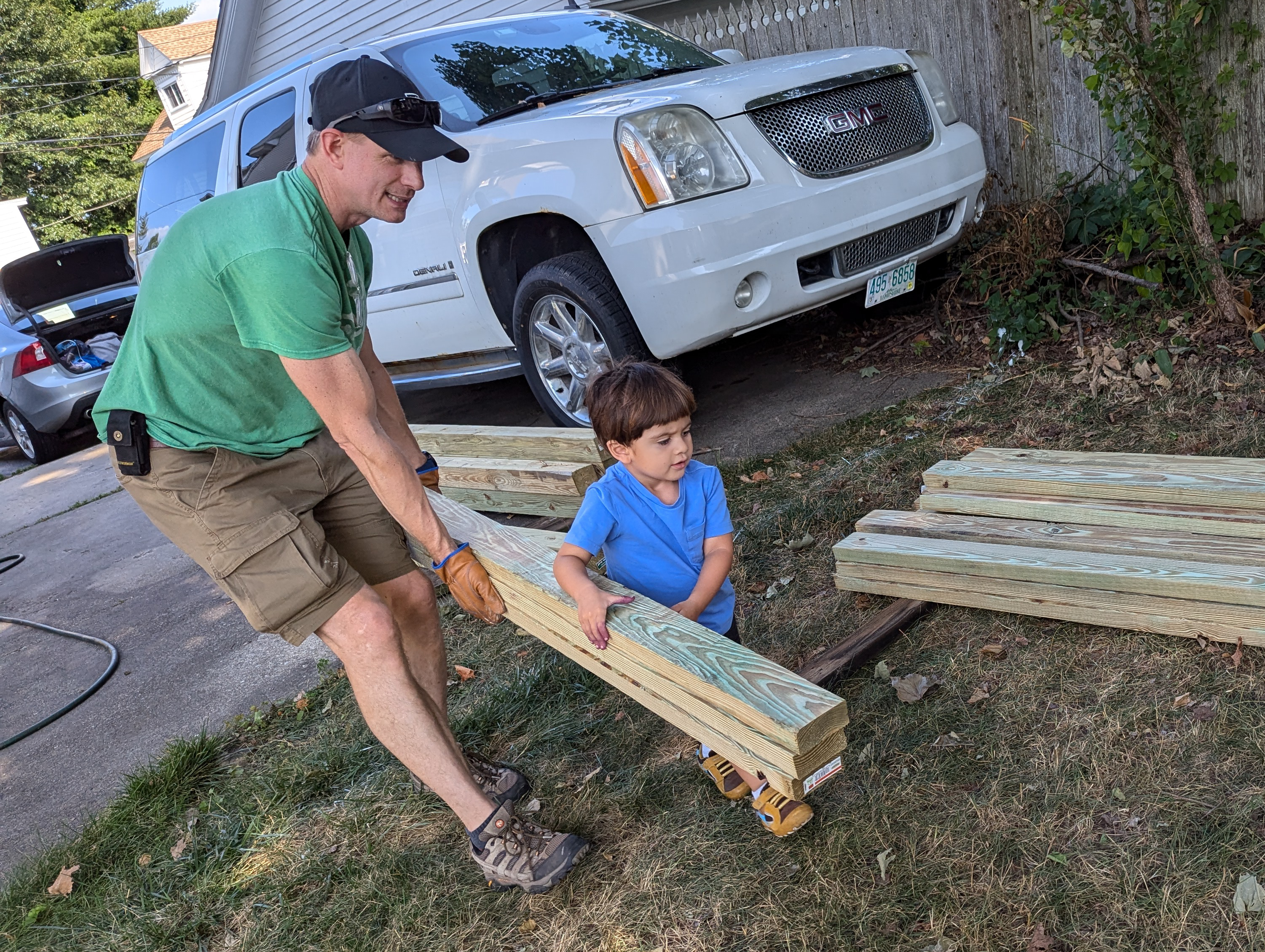 Mickey Mullin helping a child with a project