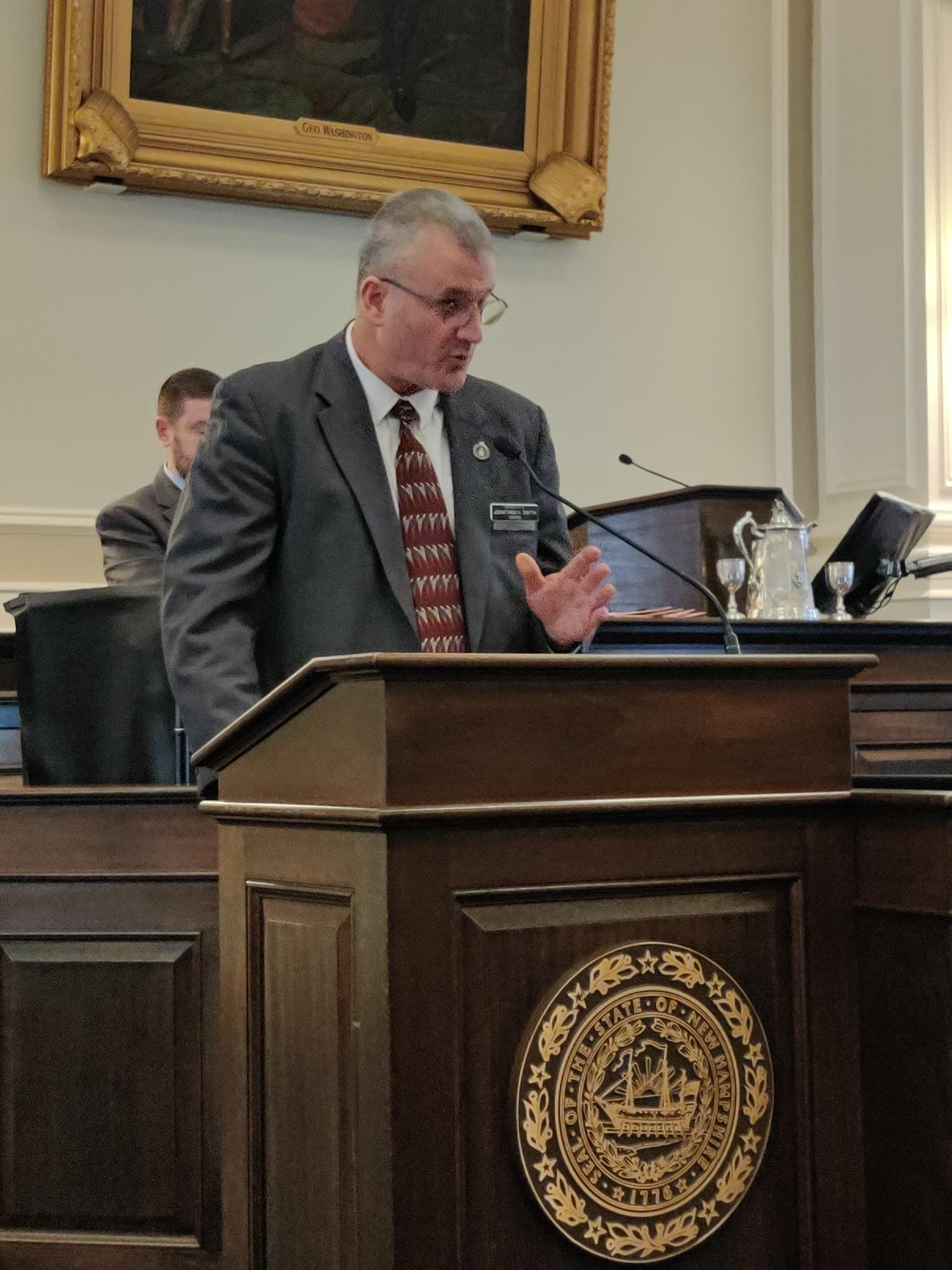 Jonathan H. Smith speaking at the podium